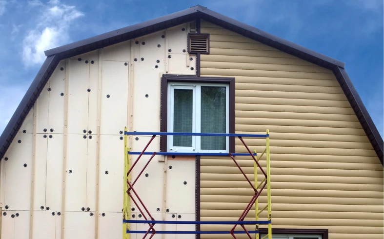 Half-finished siding on house