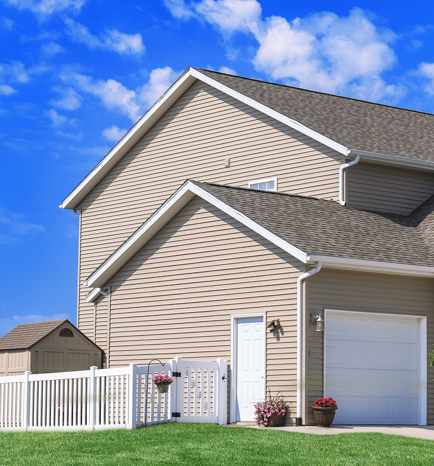 Beige house under blue sky